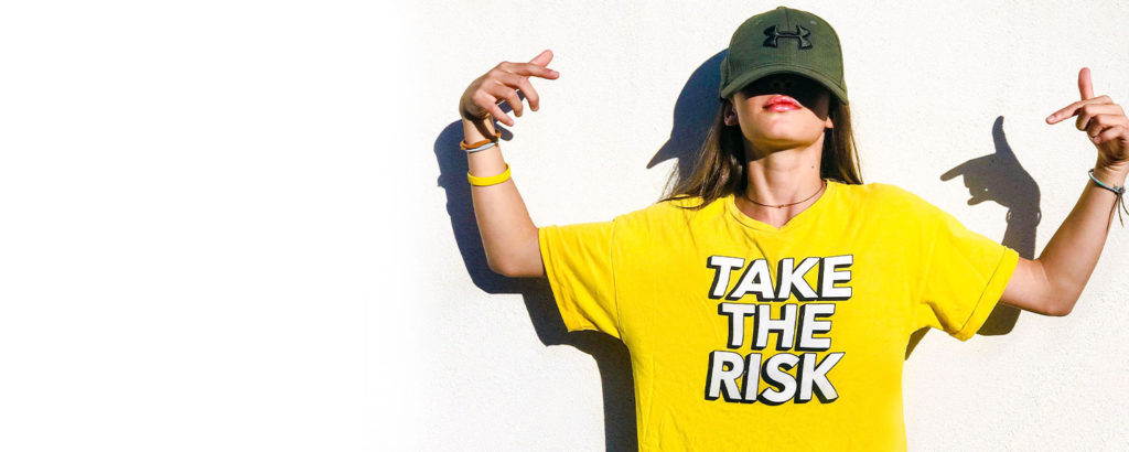 Woman with Take the Risk Shirt on