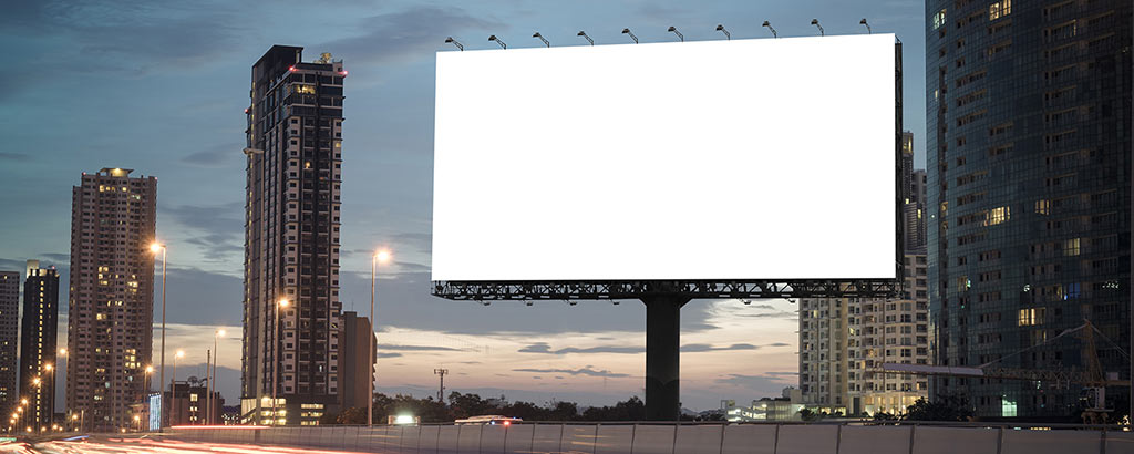 Blank billboard in city skyline
